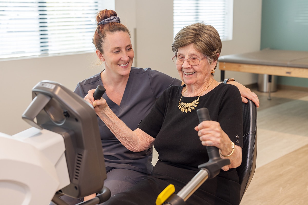 A Rehab therapists with a resident in the gym at the Pacific Villas facility