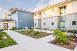 The side gardens and sidewalks of the Pacific Villas facility