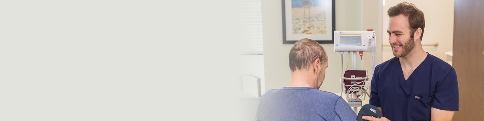 A caregiver with a resident at the Pacific Villas facility